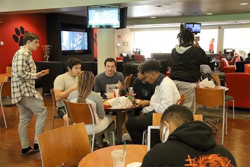 Students eat in the Lane Center